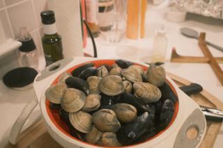 A colander of oysters and mussels.