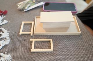 Components of the ramen stand model drying after being glued.