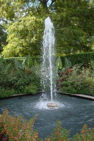 A fountain in a small pool.