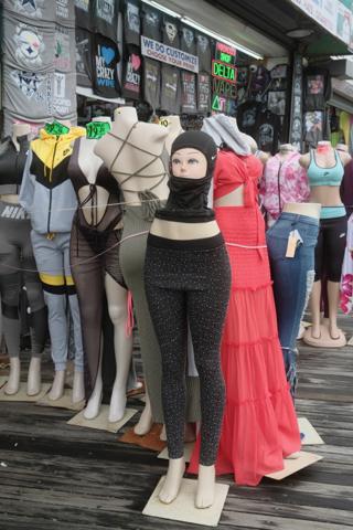 A mannequin head wiht a UV protection hood sits on top of the bottom half of a mannequin.