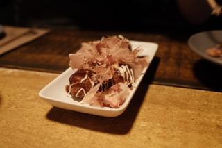 Takoyaki karaage on a long white serving dish.