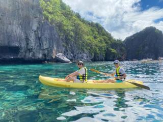 Two men in a yellow kayak.