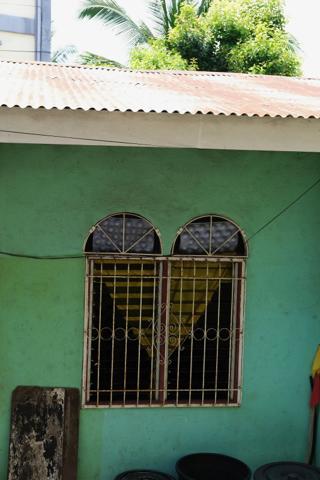 Two adjacent windows whose cutouts and shutters give the impression of forming a heart.