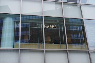 Cafe sign reading “HARBS”.