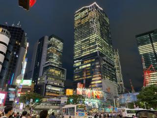 Lit-up skyscrapers ring the famous Shibuya Crossing.