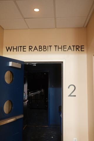 Theater entrance marked “White Rabbit Theatre”.