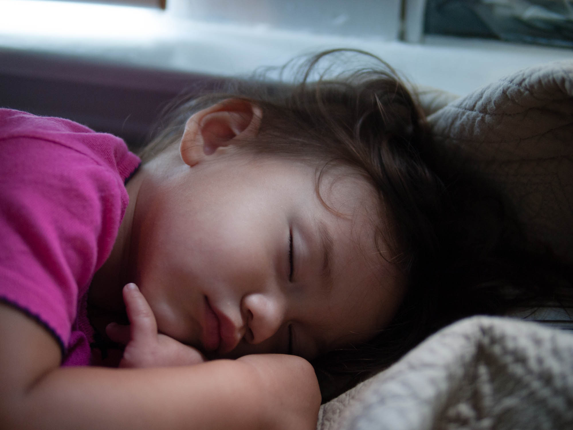 Sleeping girl with tousled hair