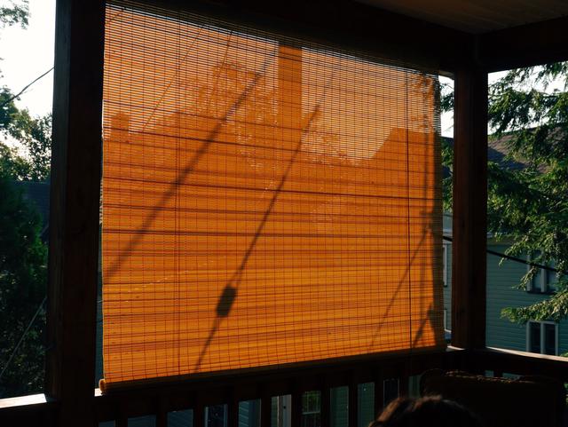 Backlit wooden window shade.