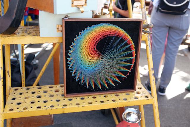 Multicolored spiral art made out of thread