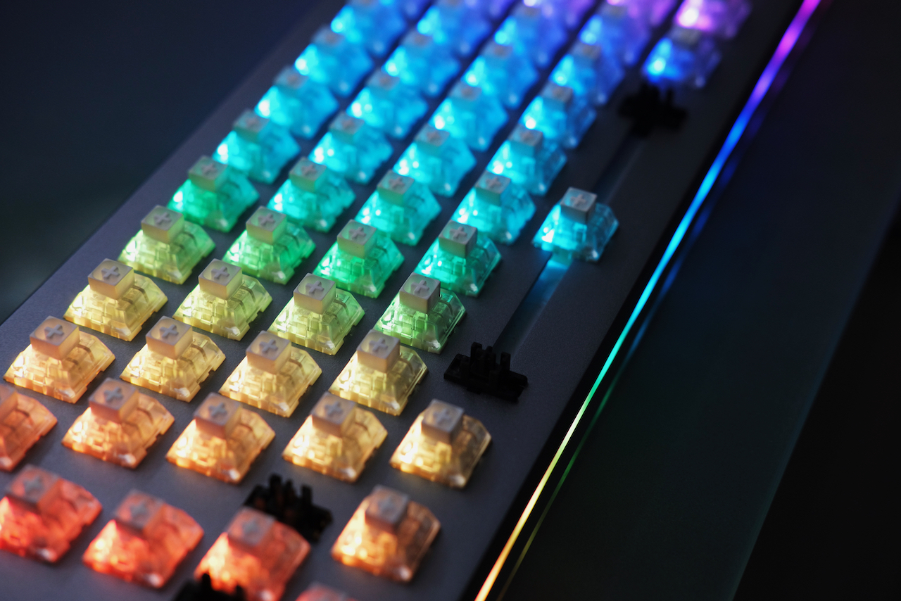 Rainbow connection. Keyboard with no keycaps and rainbow LEDs lit up.