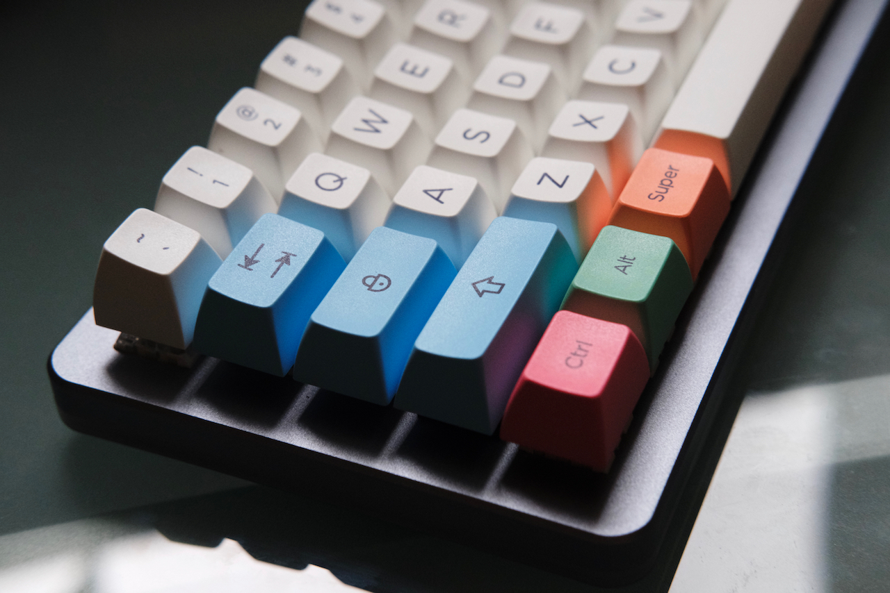 Angled view of keyboard with full SA Chalk keycap set installed.