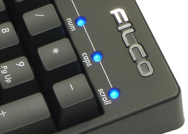 Close-up shot of the LED lights on a Filco keyboard.
