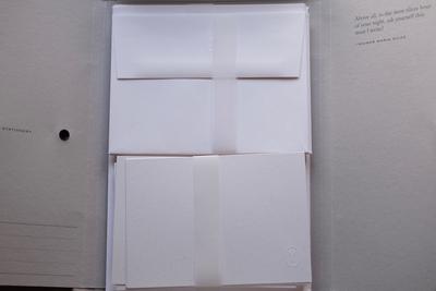 Cards and envelopes inside a folder