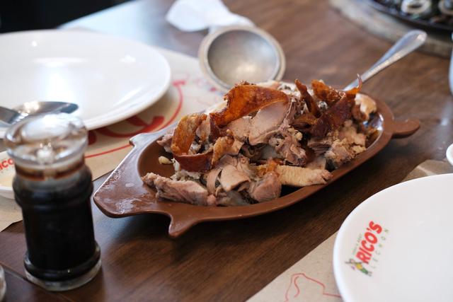 A platter with chopped-up lechon.