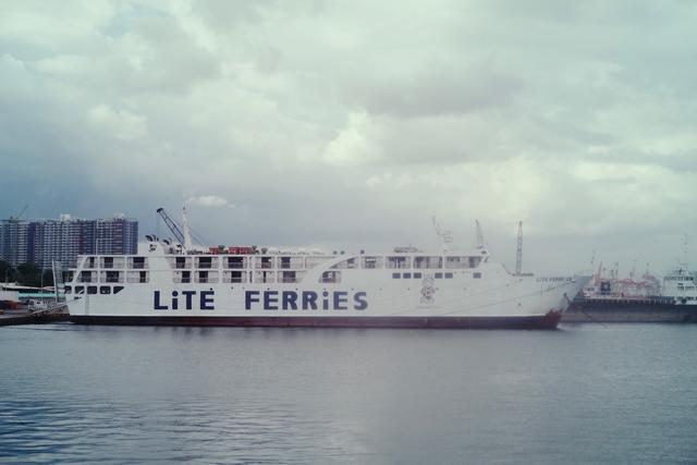 A ferry in the distance with “Lite Ferries” painted on the side