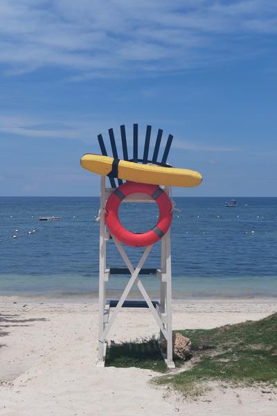 A lifeguard chair looking out on the ocean.