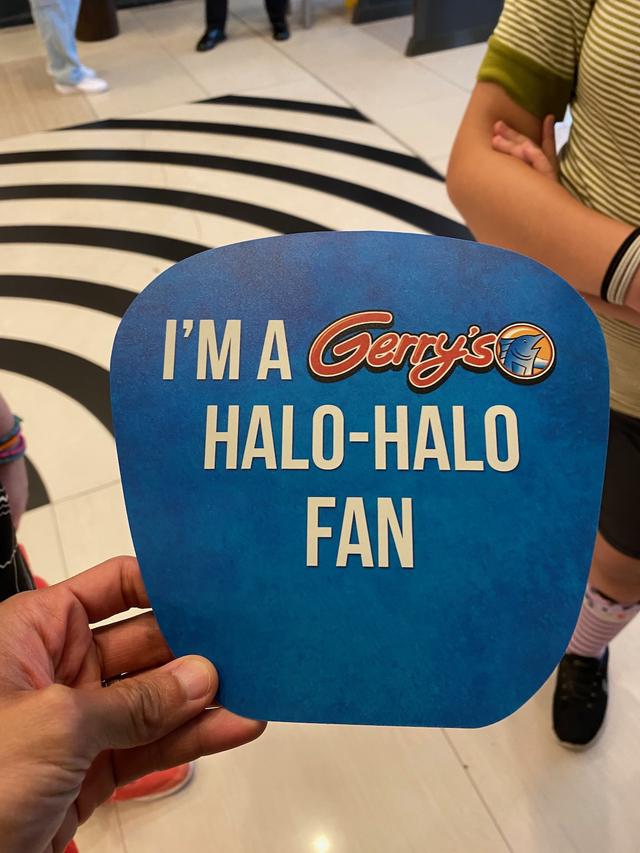 A hand fan for Gerry’s restaurant printed with the message, “I’m a Gerry’s Halo-Halo Fan”.