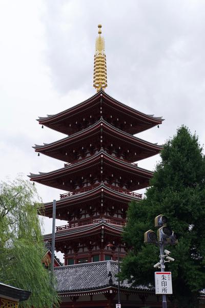 A pagoda topped with an intricate golden spire.