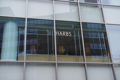 Cafe sign reading “HARBS”.
