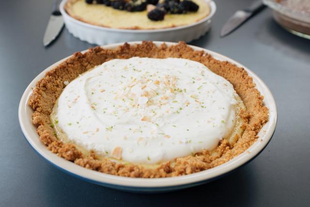 A key lime pie with lavender and toasted coconut flakes.