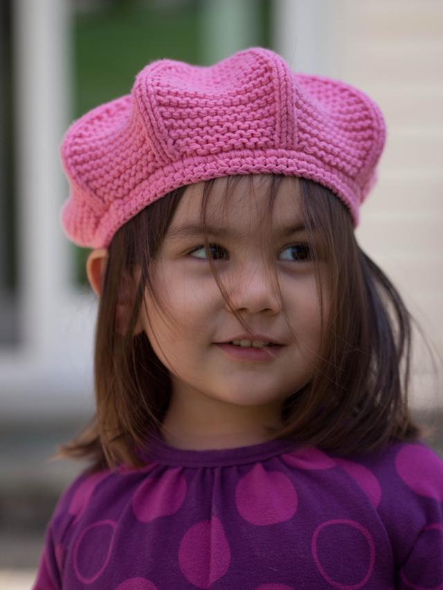Young girl in a knit beret