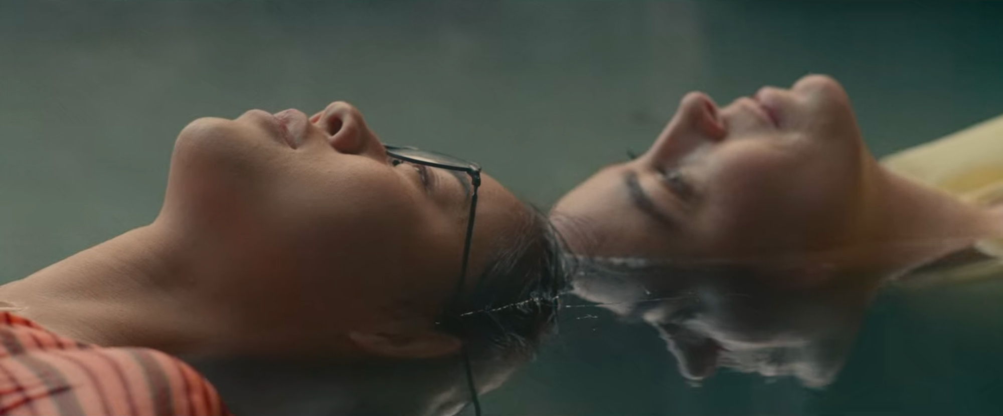 Image © Netflix. Mirroring faces, almost like a landscape.